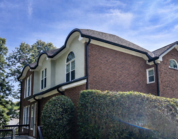 Elegant red brick house with curved roof
